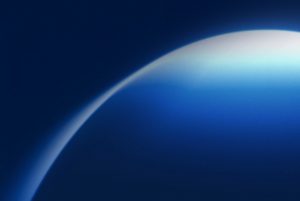 Curved blue surface against dark background