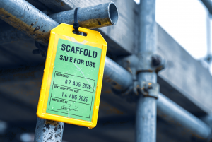 construction labour supply chain assurance, a scaffold tag reading safe for use with the next inspection already due